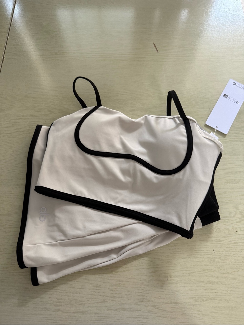 ALO Yoga Cream Sports Bra and Skort with Black Trim - Picture 5 of 6